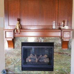 cherry mantle and paneled wall above basement fireplace