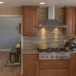 full height stack stone backsplash in Colorado remodel