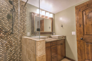modern bathroom featuring a glass-enclosed shower stall