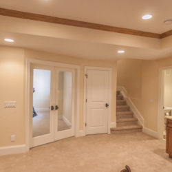 Finished basement with Shaw brand nylon carpet on floor and stairway.