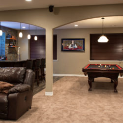 Basement finish in Denver, Colorado with wet bar and pool table.