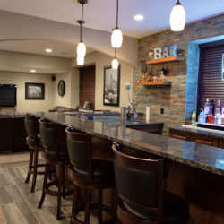 Basement design bar and rock wall idea