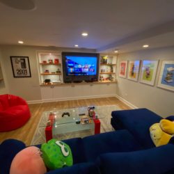 cozy basement media room with a dark ceiling