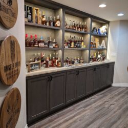 home bar setup with dark cabinet