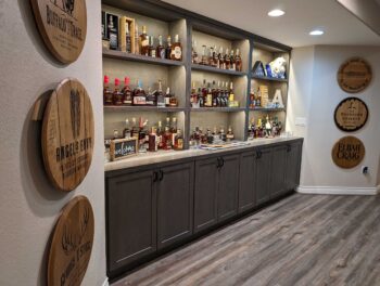 home bar setup with dark cabinet